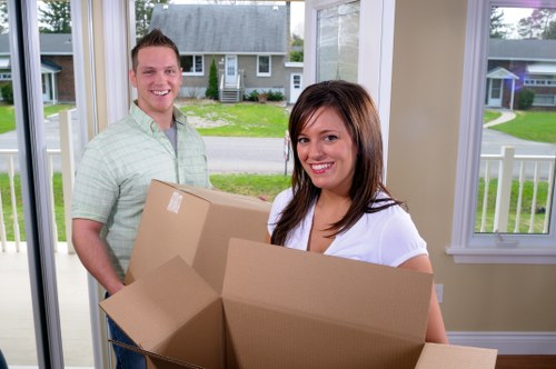 Removal team handling home furniture during a Stratford move