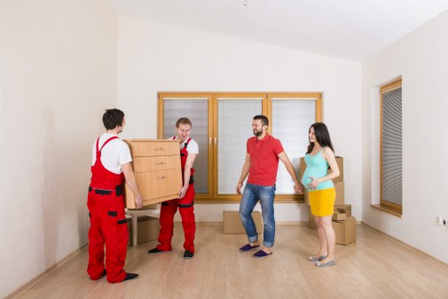 Professional movers loading boxes for urgent relocation in Stratford