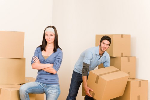 Professional removal van in Stratford near modern apartment buildings