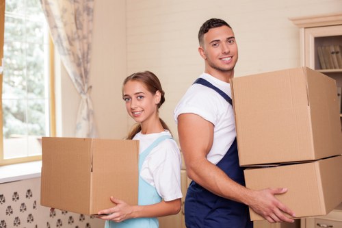 Professional movers handling furniture in Stratford