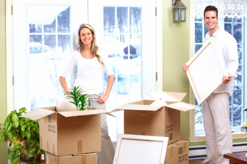 Removal team handling furniture during a Stratford home move