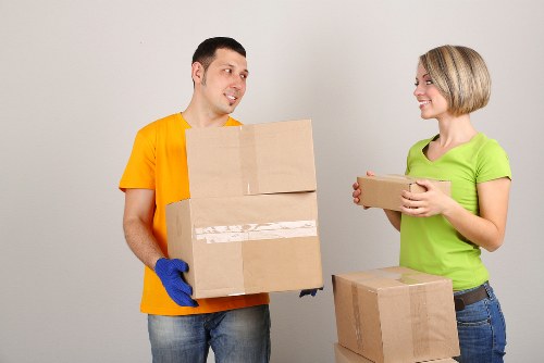 Loading furniture into a van for a Stratford moving service