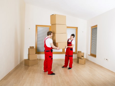 Van loading scene with secure items and safe manual handling practices