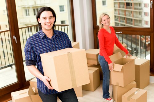 Packed office boxes and equipment ready for Stratford removal